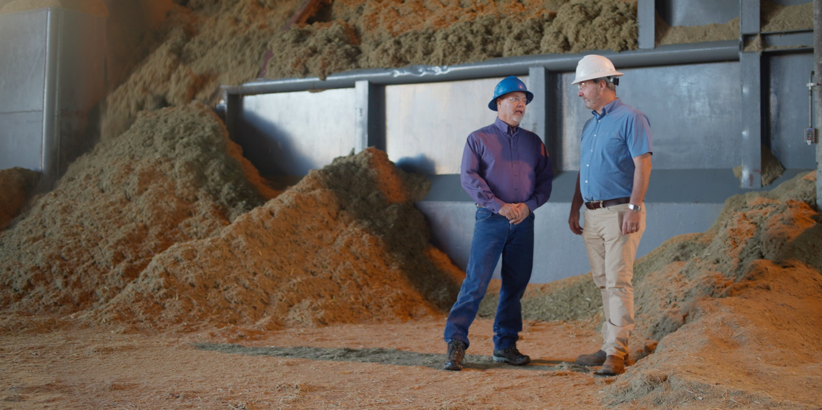 two men talking at a construction site